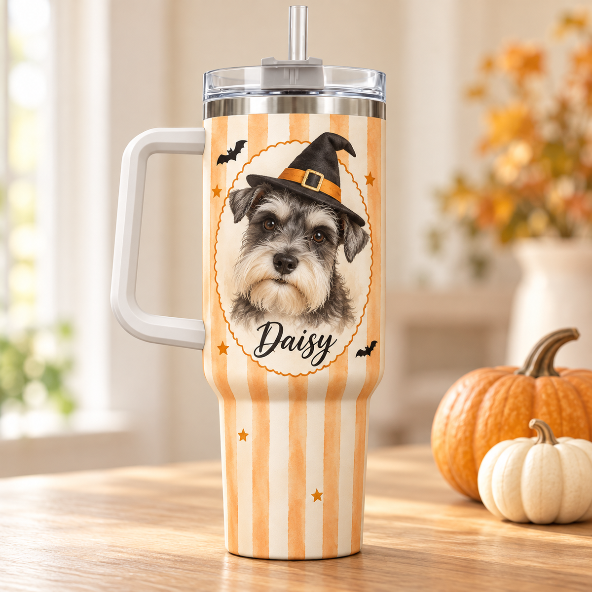 Custom dog portrait Halloween tumbler with Daisy the Schnauzer in a witch hat, cream-orange stripes and white handle.