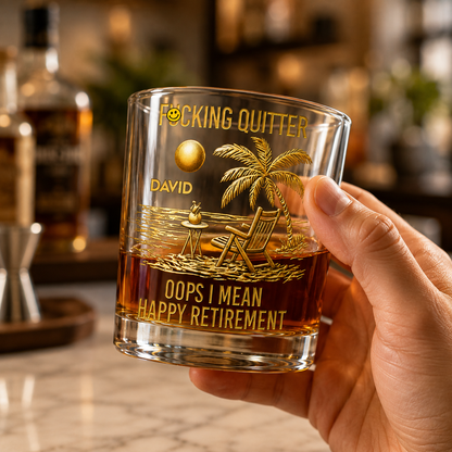 Handheld personalized retirement whiskey glass gift for him, showing gold beach artwork and Funny Quitter Happy Retirement design