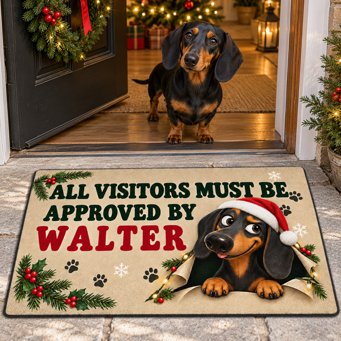 Sipengrave Dachshund Christmas Doormat Gift With Dog Name beside a real Black and Tan Dachshund at a Christmas doorway.